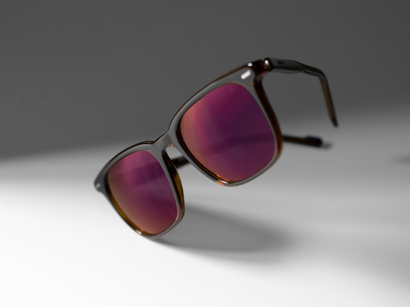 ZEISS DuraVision Gold UV lens coating on tinted sunglass lenses in Burgundy color.