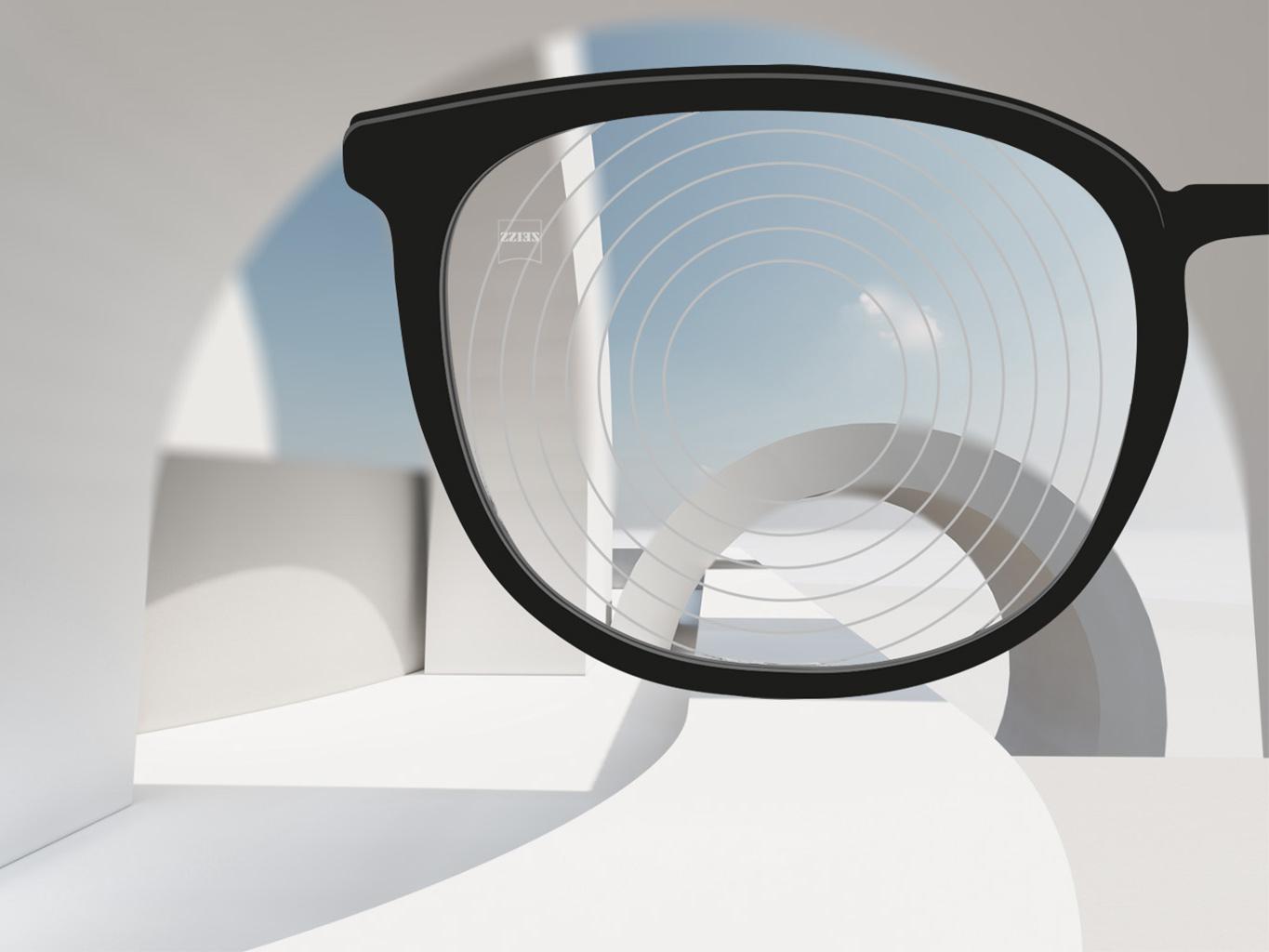 A close-up image of Myopia Management lenses by ZEISS, with black eyeglass frames and concentric circles on the lens surface.