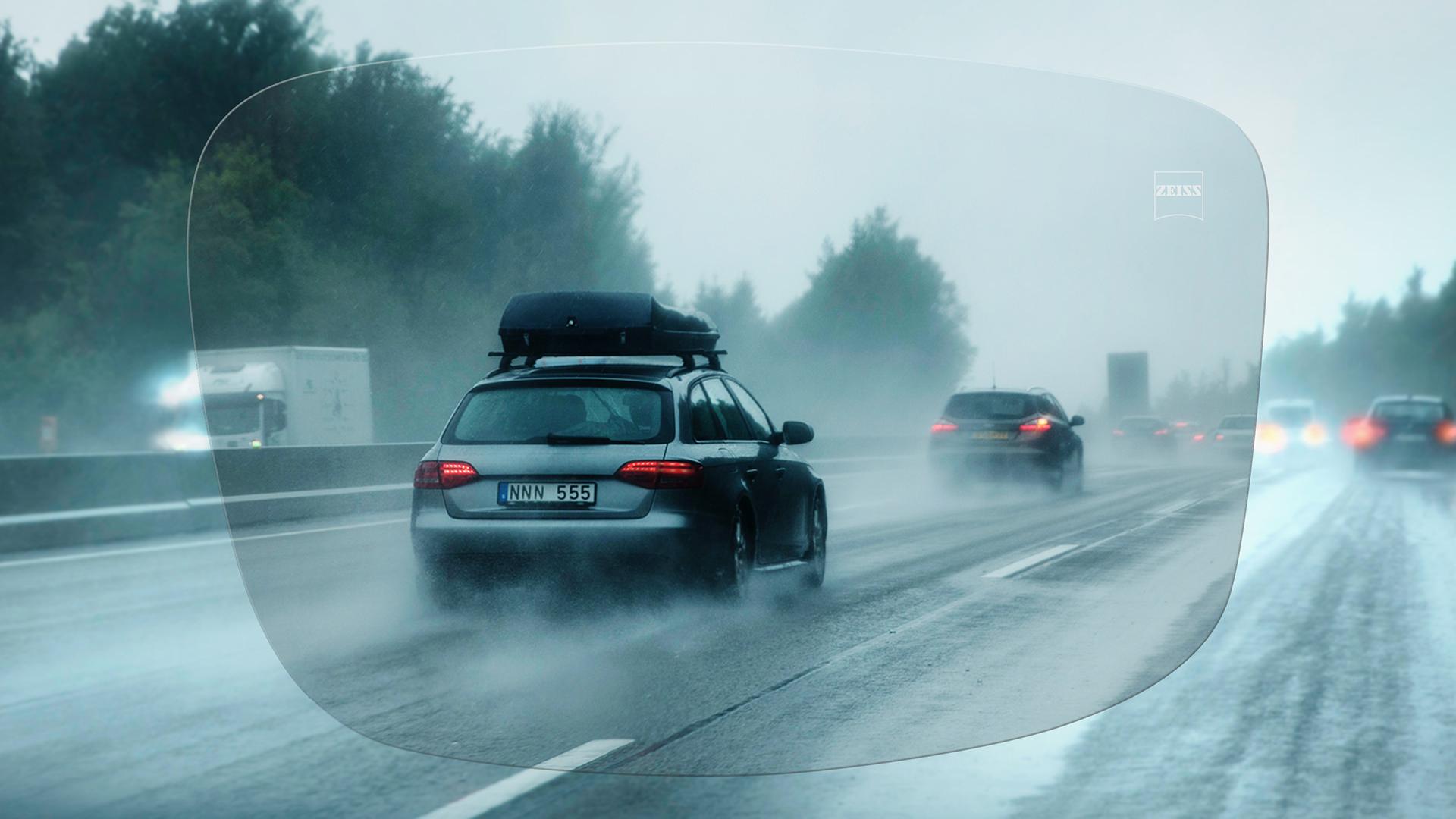 View through ZEISS DriveSafe Single Vision Individual lens of a highway on a rainy day 