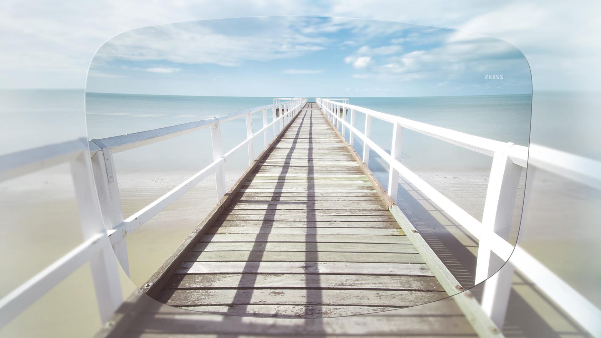 View through ZEISS Single Vision Stock (FSV) lens of a pier on a sunny day 