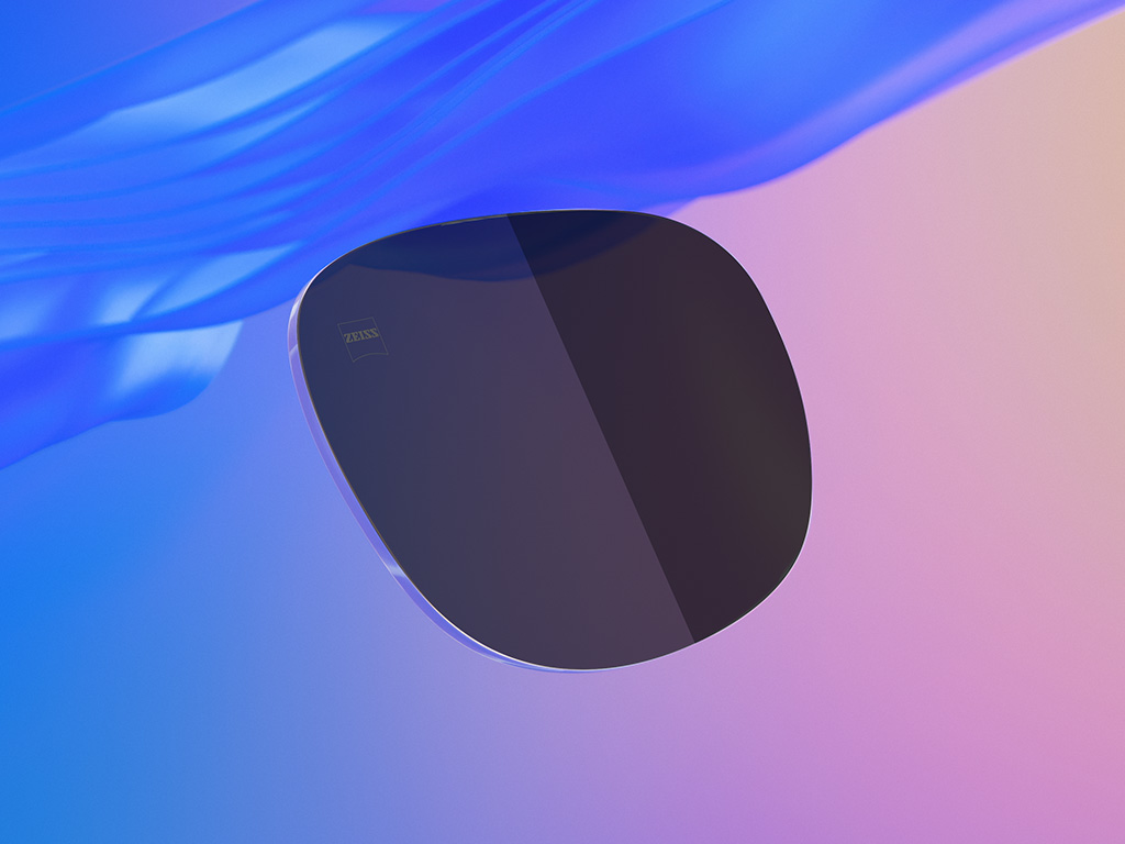 Illustration 3D en images de synthèse d’un verre de lunettes de soleil teinté, dont la moitié présente un niveau d&apos;assombrissement plus clair que l’autre.