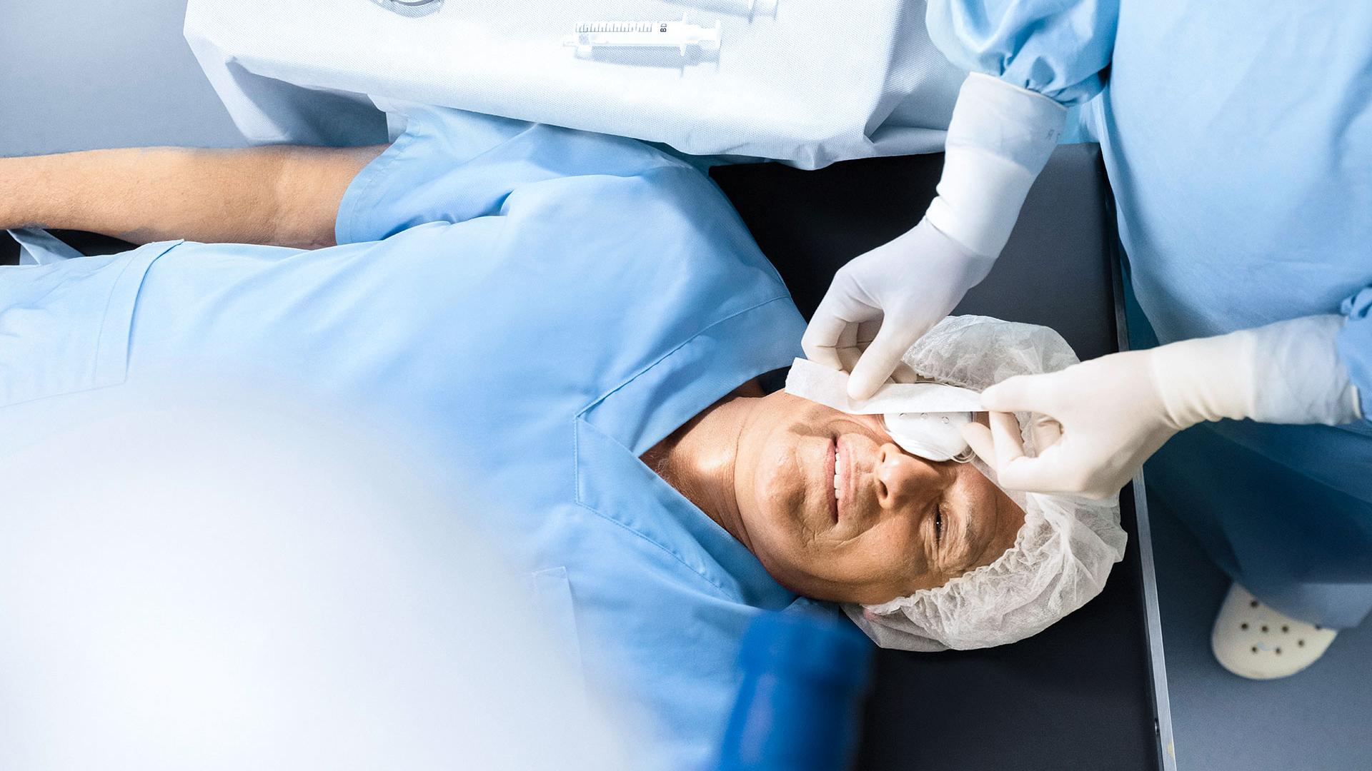 Patient with a protective patch over the eye after cataract surgery.