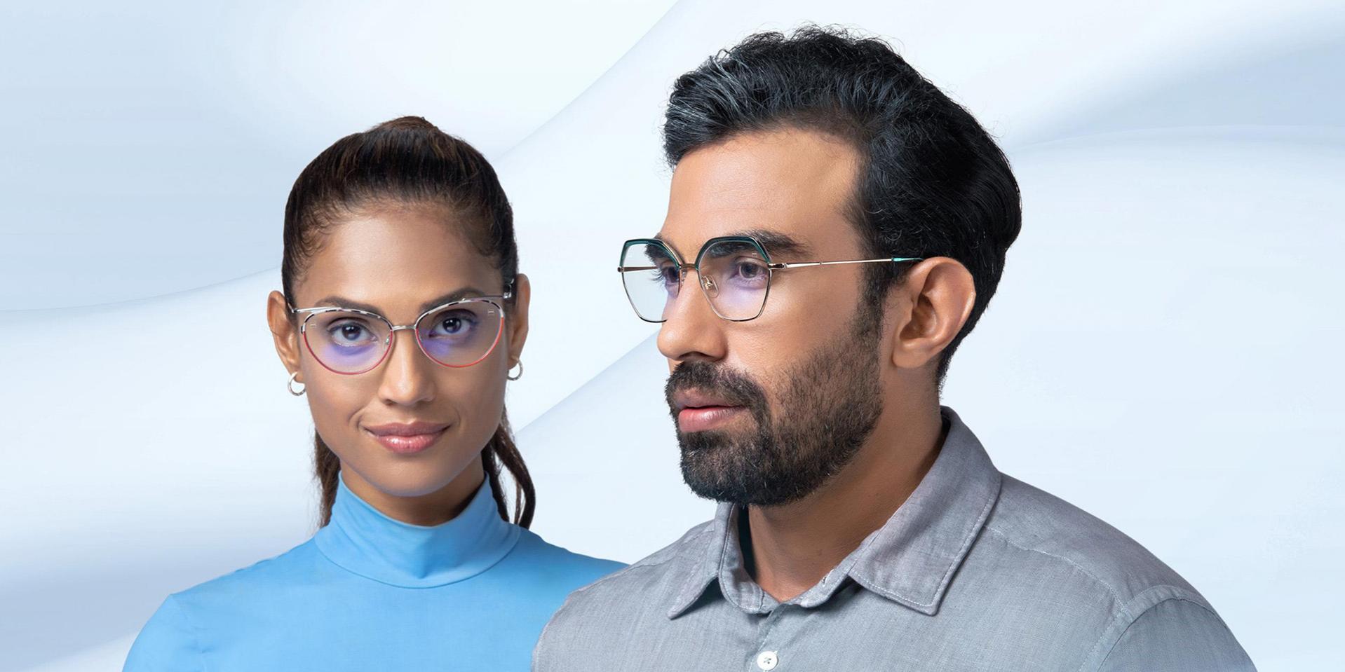 A middle-aged woman and man wearing ZEISS Progressive Light 2 lenses.